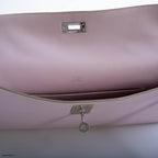 Front view of Hermes Kelly Longue in Rose Dragee Evergrain leather with palladium hardware.