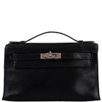 Front view of Hermes Kelly Mini Pochette in black Swift leather with palladium hardware.