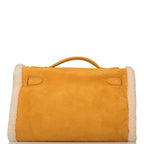 Rear view of Teddy Kelly muff bag in suede and shearling