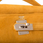 Hermes Kelly Muff styled in hand for cold-weather look