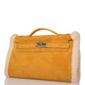 Top handle detail of Hermes Kelly Muff in sable suede