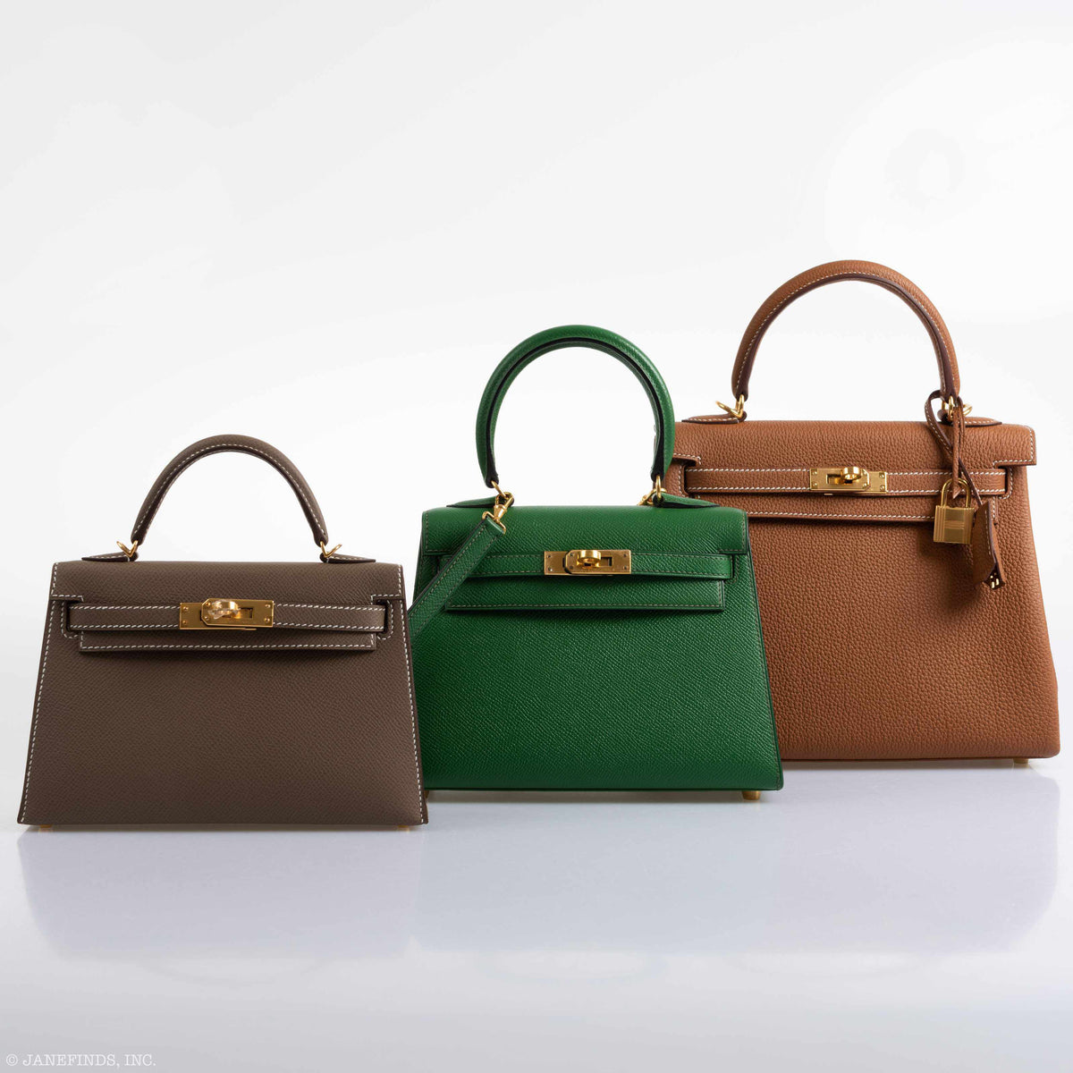 The base of the Hermes Kelly Mini Pochette, highlighting the protective metal feet