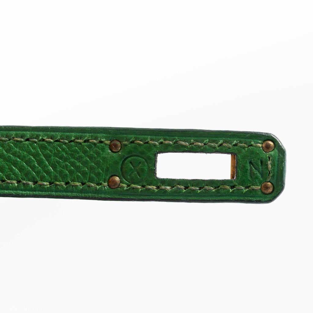 A diagonal, three-quarter view of the Hermes Kelly Mini Pochette, showing its full dimensions