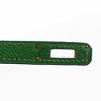 A diagonal, three-quarter view of the Hermes Kelly Mini Pochette, showing its full dimensions