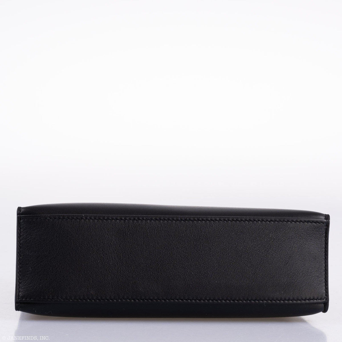A shot focused on the front closure straps and the gold-tone turn-lock