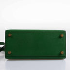 An open view of the bag's interior, showing the single slip pocket and matte leather lining