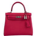 Front view of the Hermes Kelly Retourne 25 in Framboise Togo leather