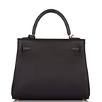 A view of the signature gold-tone turn-lock on the front flap of the bag
