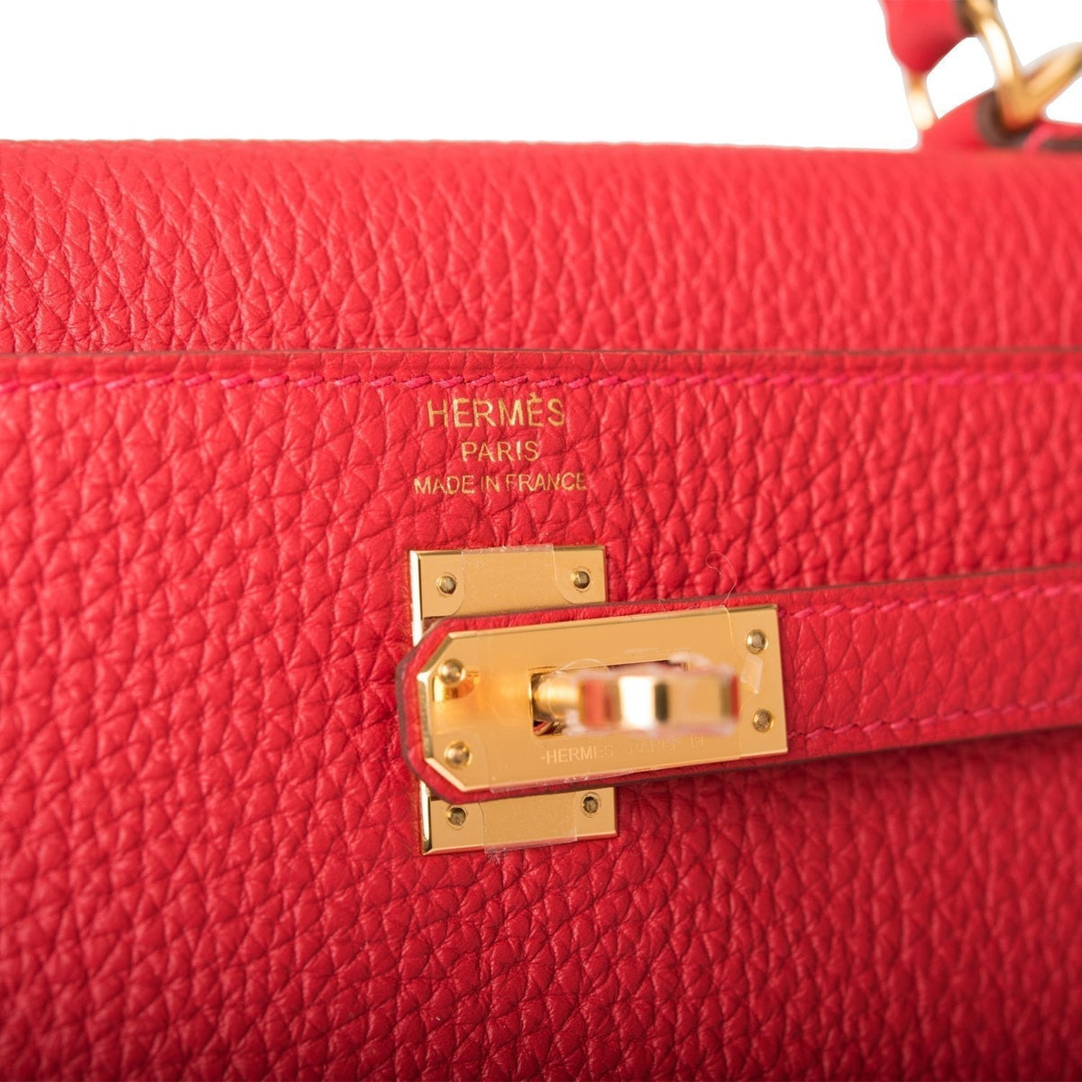 A detailed view of the handle and the clochette with its lock and keys
