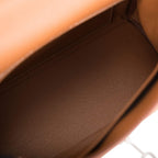A view of the handle and shoulder strap connection point on the side of the bag