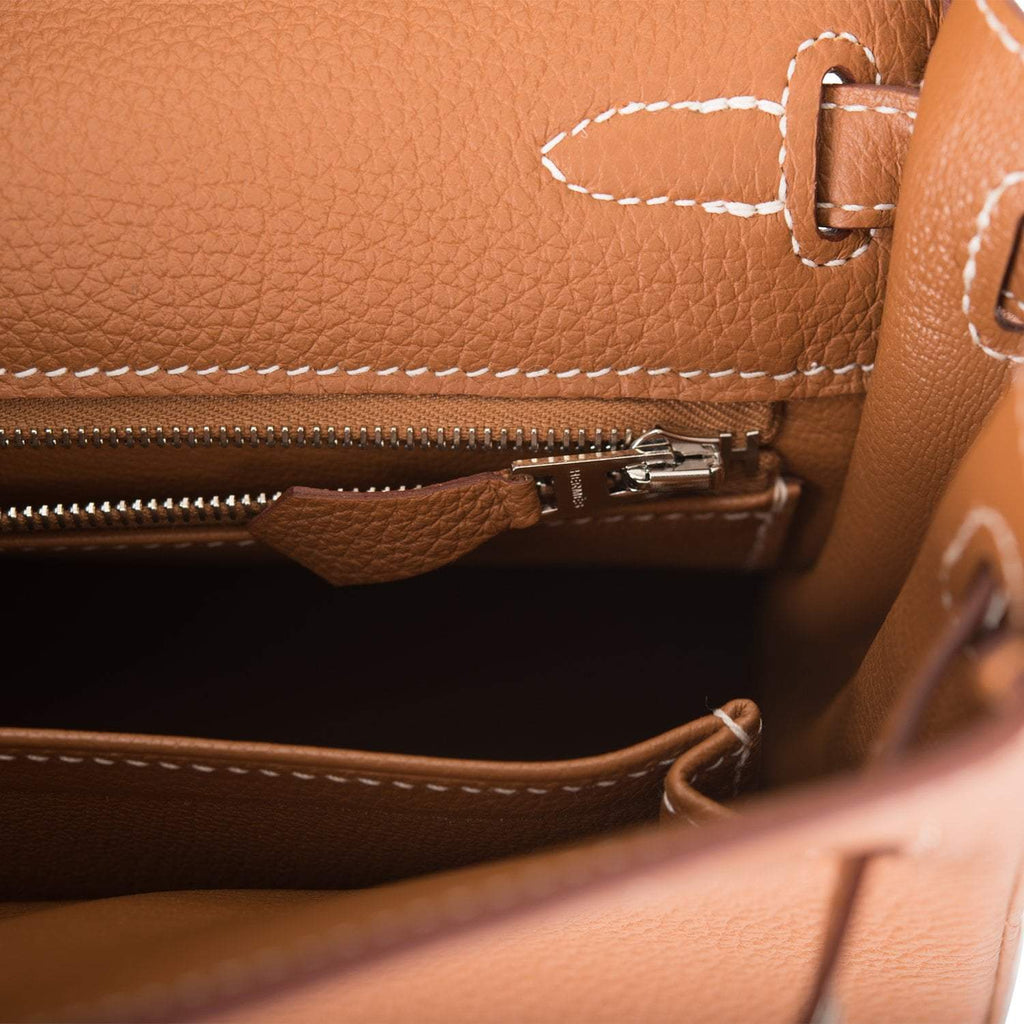 The interior of the handbag, showing the Chevre leather lining