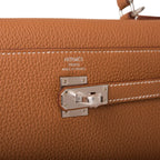 The palladium-tone clochette, lock, and keys hanging from the handle