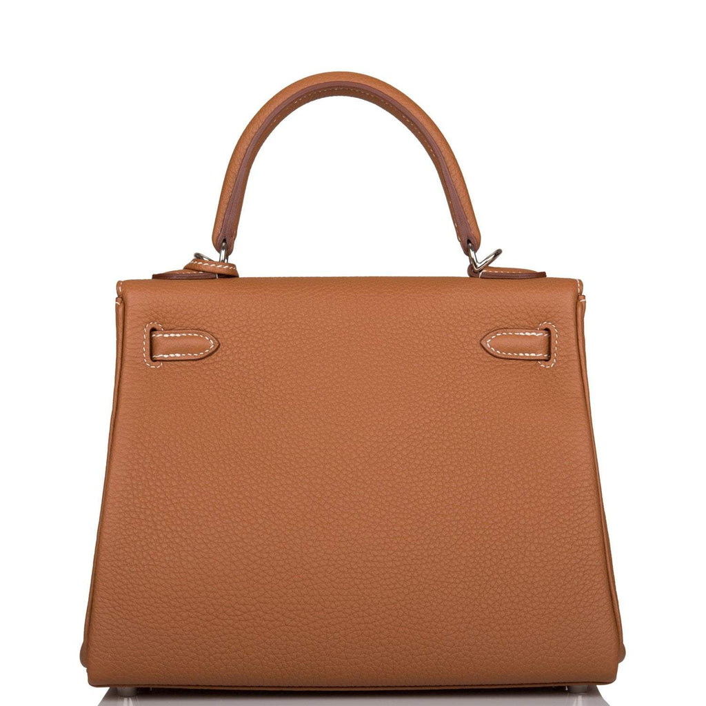 A view of the signature palladium-tone turn-lock on the front flap of the bag