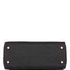 The Hermes Kelly Retourne 25 with its removable shoulder strap attached