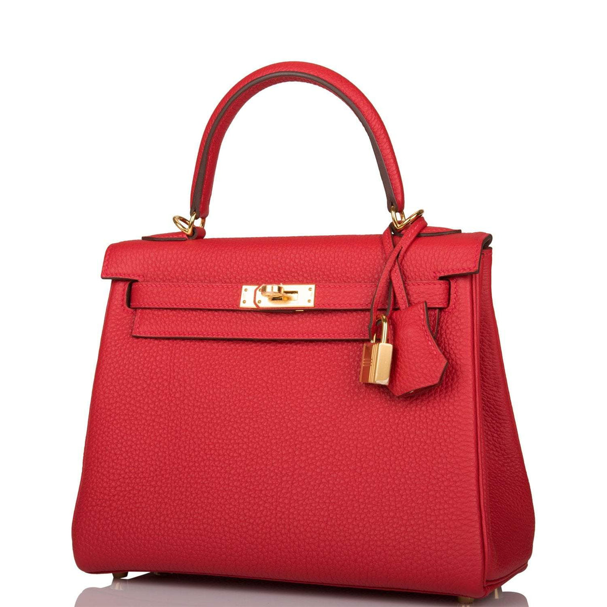 The Hermes Kelly Retourne 25 with a decorative silk twilly tied around the handle