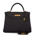 Front view of the Hermes Kelly Retourne 32 in Black Togo leather