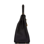 The Hermes Kelly Retourne 32 displayed on a surface, highlighting its classic form