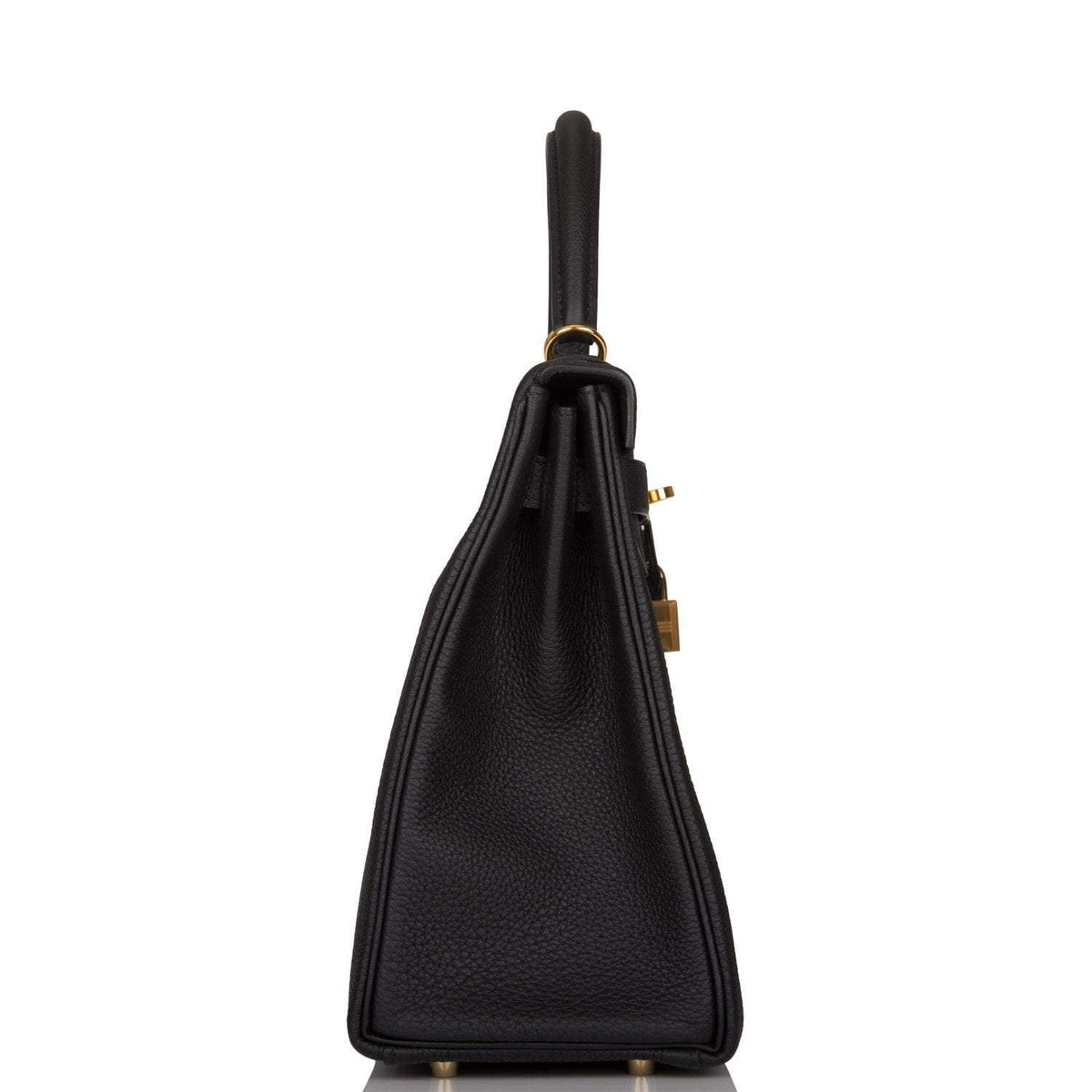 The Hermes Kelly Retourne 32 displayed on a surface, highlighting its classic form