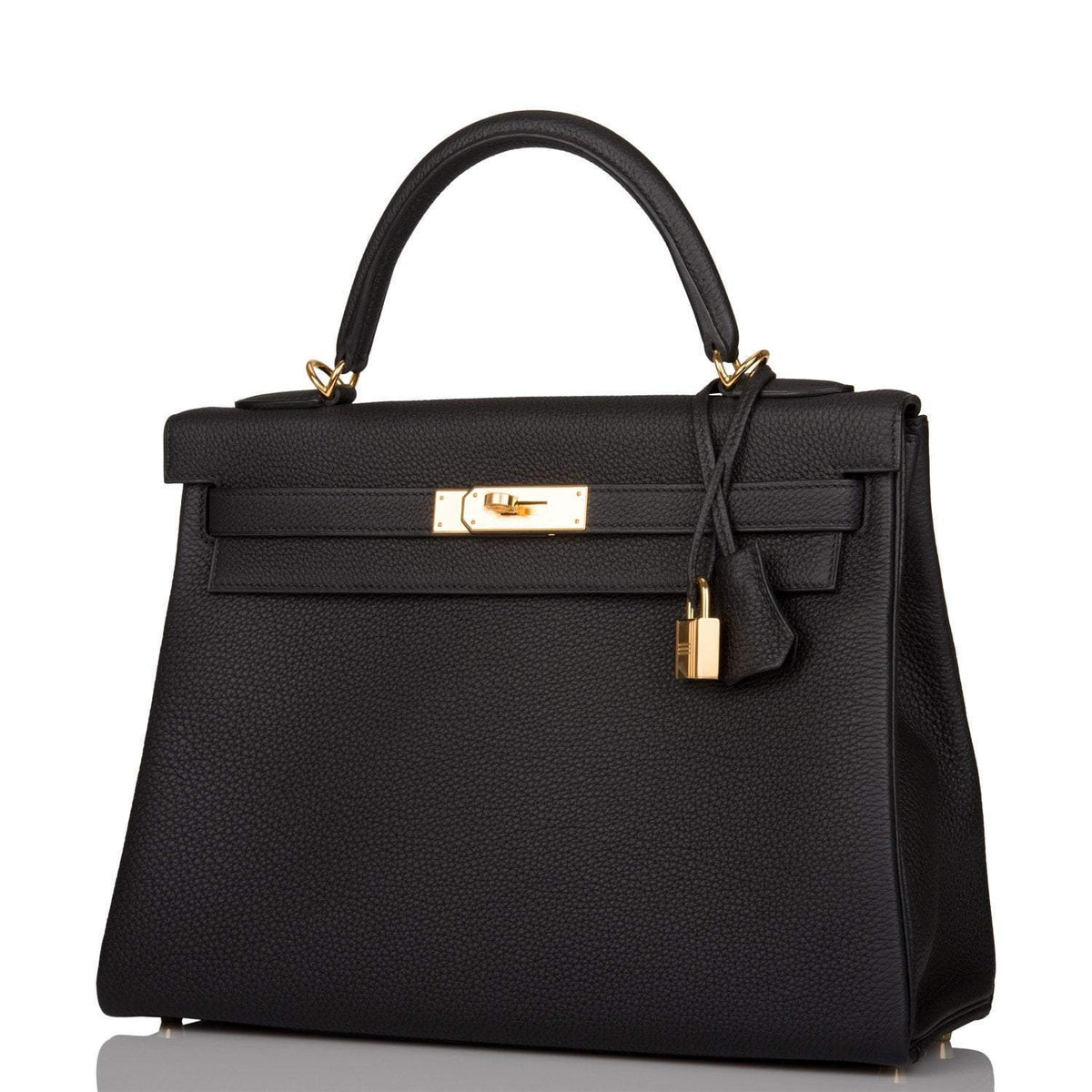 The clochette, lock, and keys in gold-tone hardware hanging from the handle