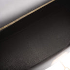 An image of the interior zip pocket with the Hermes-engraved pull