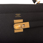A shot of the removable shoulder strap and its gold-tone clasps