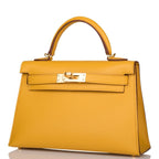 A view of the signature gold-tone turn-lock on the front flap of the bag