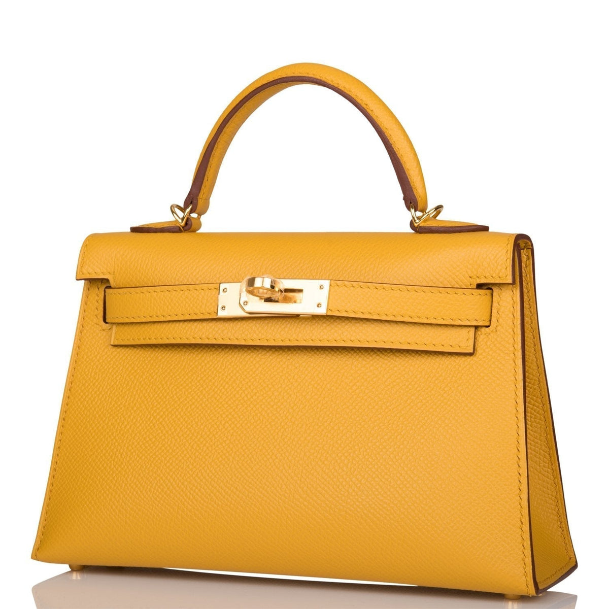 A view of the signature gold-tone turn-lock on the front flap of the bag