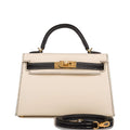 Front view of the Hermes Kelly Sellier 20 in Nata and Black Epsom leather