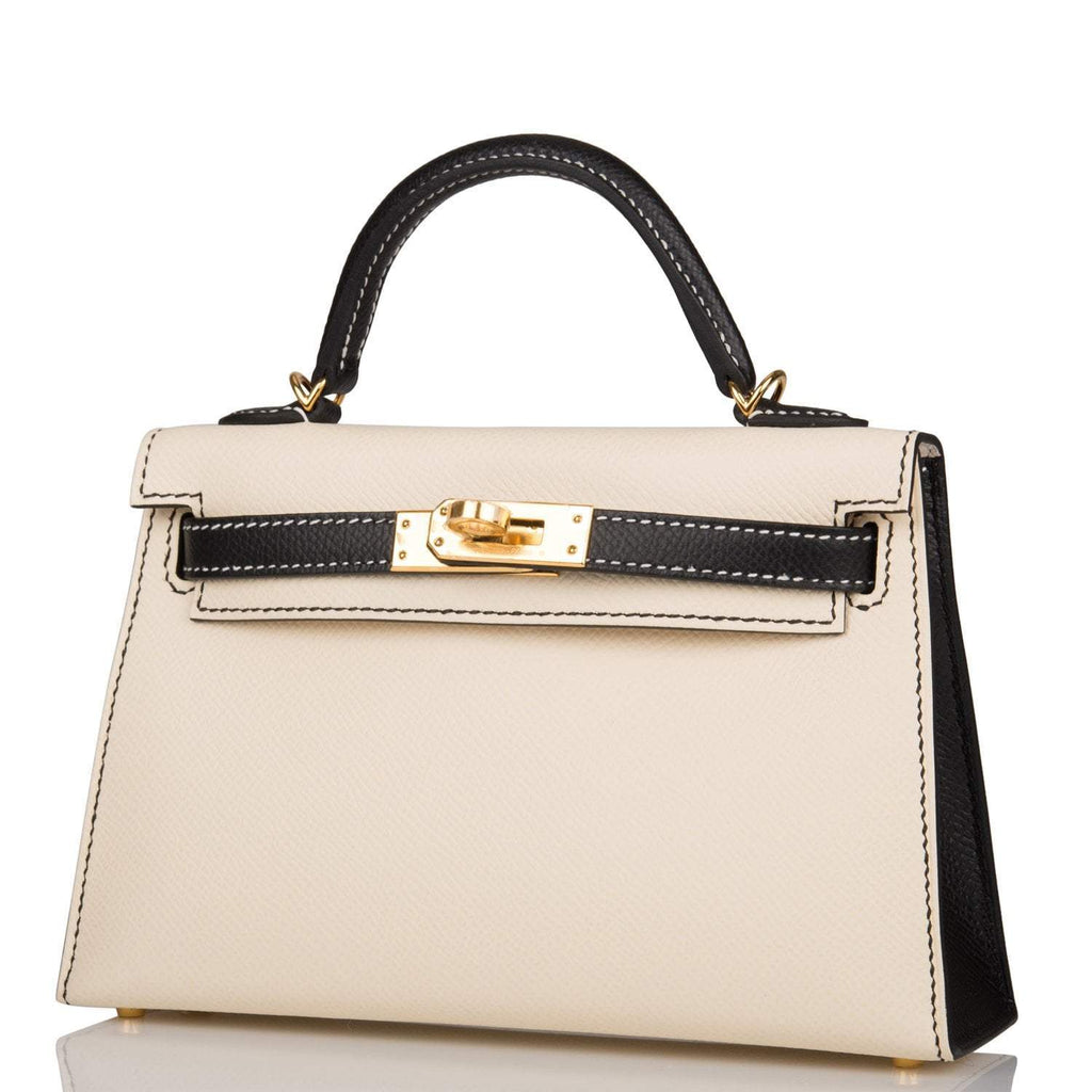 The bag being carried by hand, highlighting its miniature size