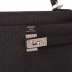 A close-up of the palladium-tone hardware, clochette, and lock.