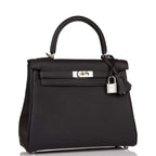 Close-up of the palladium-tone hardware and toggle closure on the Hermes Kelly 20