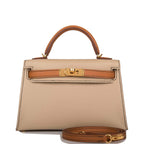 Front view of the Hermes Kelly Sellier 20 in Trench and Gold Epsom leather