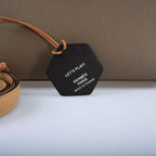 The bag being carried by hand by a person, demonstrating its scale