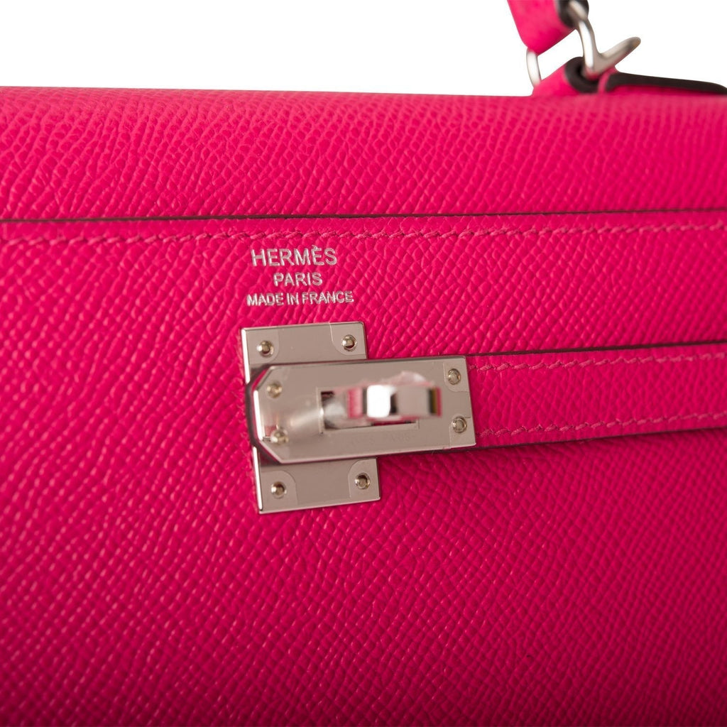 A side view of the clochette and the shoulder strap attachment