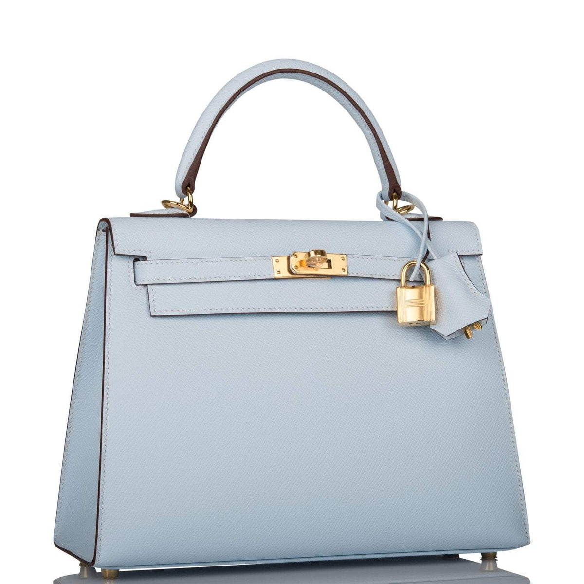 Close-up of the gold-tone hardware and toggle closure on the Hermes Kelly 25