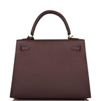 A view of the signature gold-tone turn-lock on the front flap of the bag