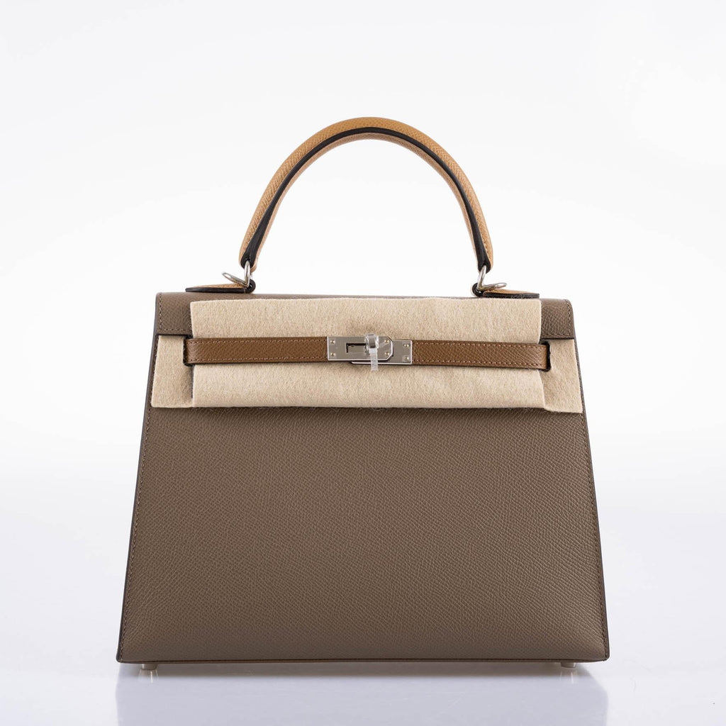 A detailed shot of the rolled top handle and the hanging clochette