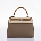 A detailed shot of the rolled top handle and the hanging clochette