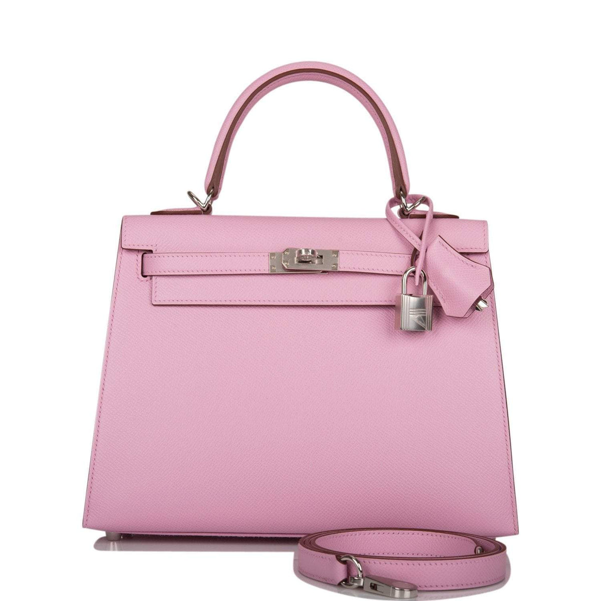 Close-up of the palladium-tone hardware and toggle closure on the Hermes Kelly 25