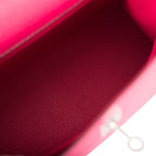 The interior of the bag, showing the zip pocket with the Hermes-engraved pull