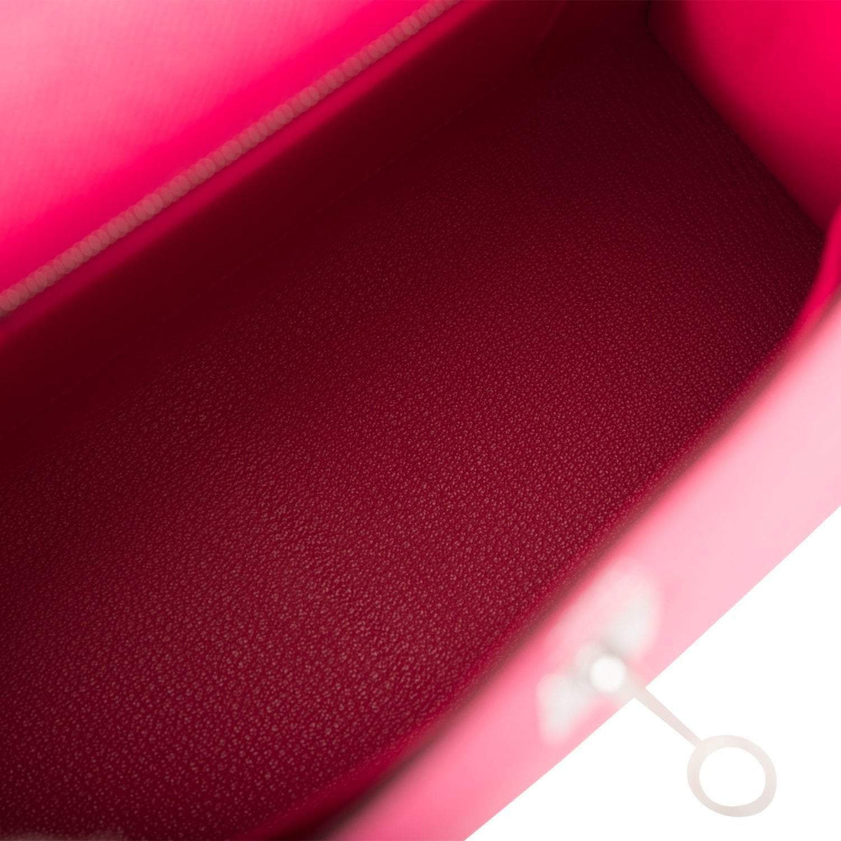 The interior of the bag, showing the zip pocket with the Hermes-engraved pull