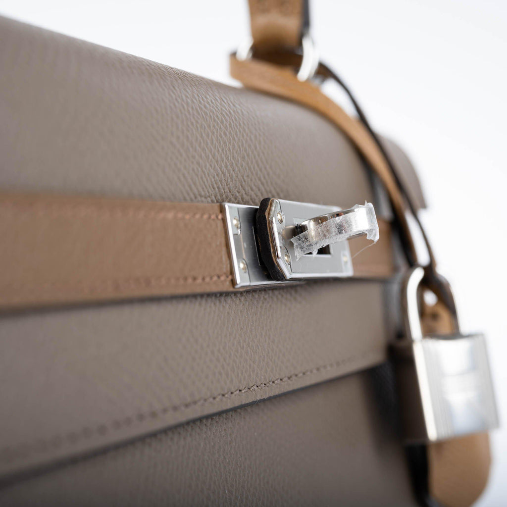 A close-up of the palladium-tone clochette, lock, and keys