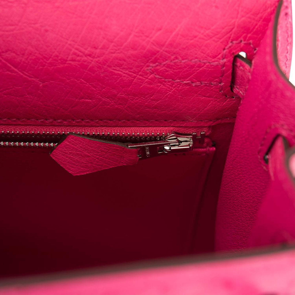A close-up of the palladium-tone turnlock in the open position