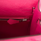 A close-up of the palladium-tone turnlock in the open position