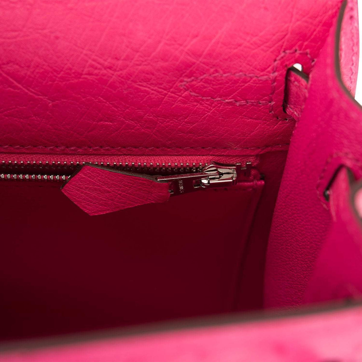 A close-up of the palladium-tone turnlock in the open position