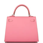 The Rose Confetti Epsom Kelly 25 being carried in hand, showing its compact size