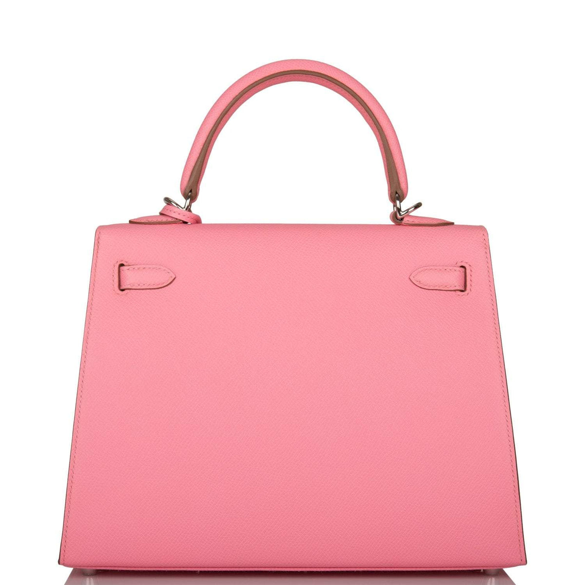 The Rose Confetti Epsom Kelly 25 being carried in hand, showing its compact size