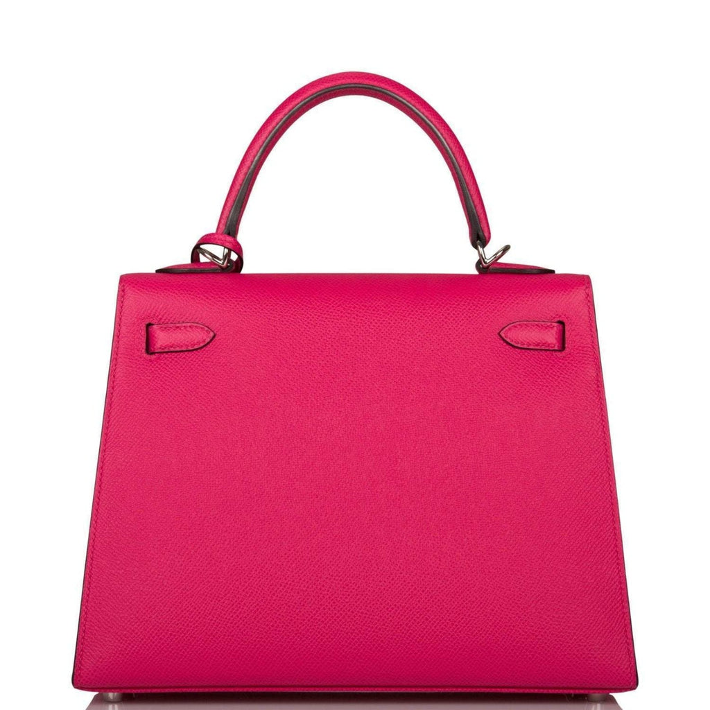 The Rose Mexico Epsom Kelly 25 being held by a hand, showing its compact scale