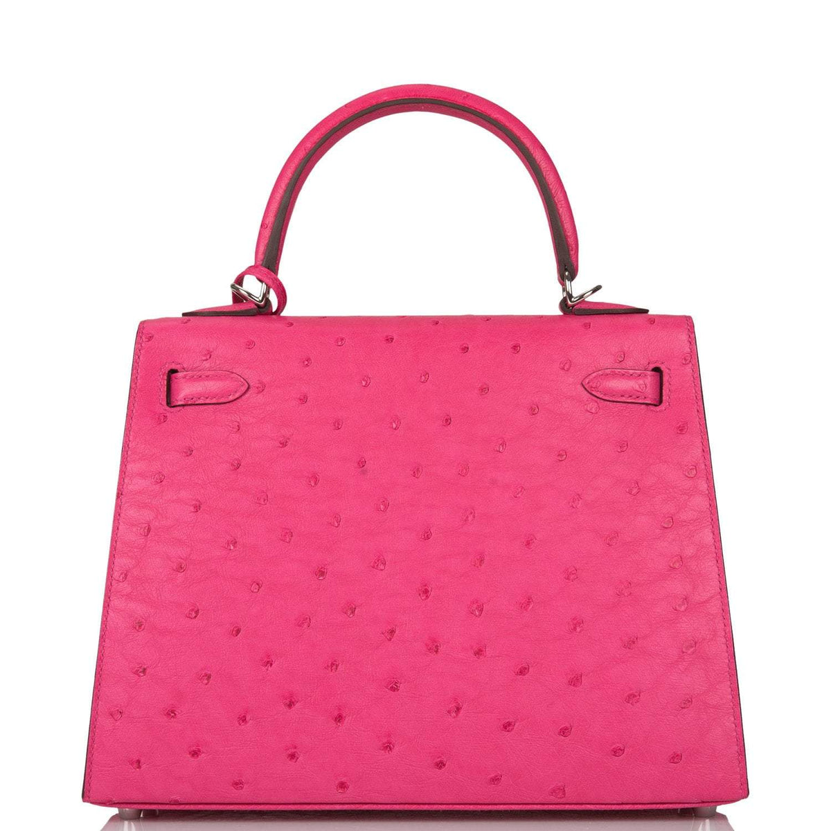 The Hermes Kelly Sellier 25 displayed on a surface, highlighting its structured form