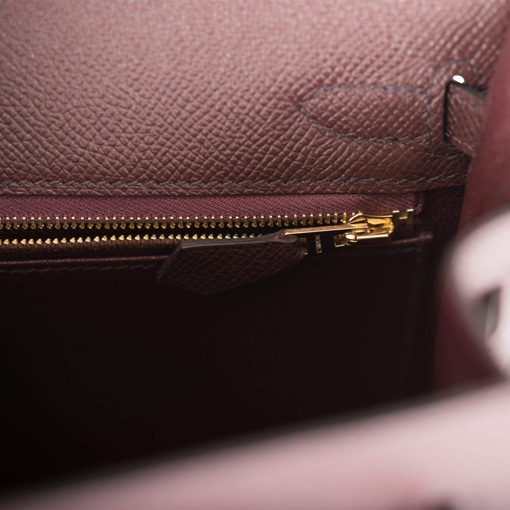 The Hermes Kelly Sellier 25 displayed on a surface, highlighting its structured form